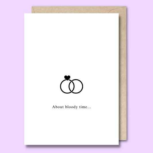 Greeting card with an image of two rings on the front. The text says “About bloody time”