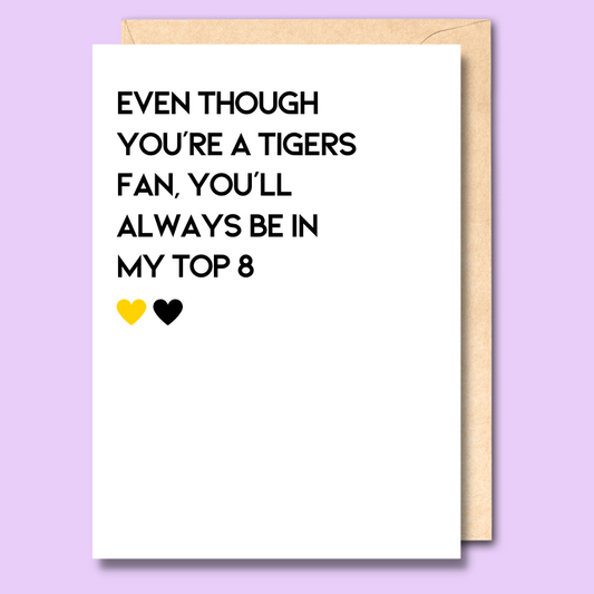 A white greeting card that says 'Even though you're a Tigers fan, you'll always be in my top 8'