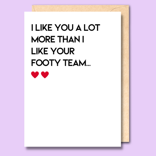 A white greeting card that says 'I like you a lot more than I like your footy team'