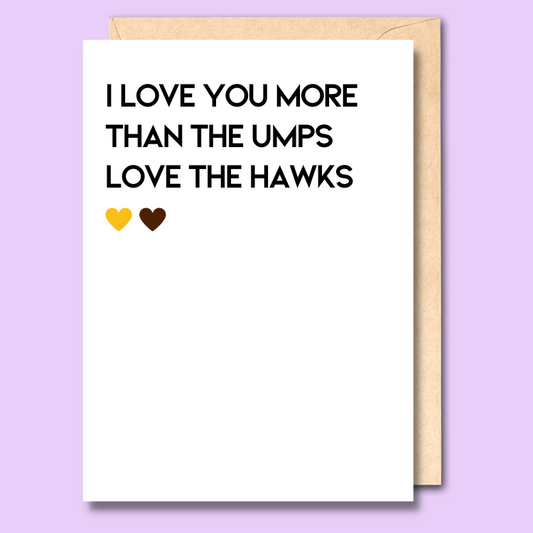 A white greeting card that says 'I love you more than the umps love the Hawks'