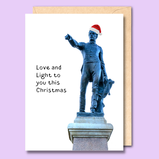 Greeting card with an image of Colonel Light wearing a Santa hat on the front. The text says “Love and Light to you this Christmas.”