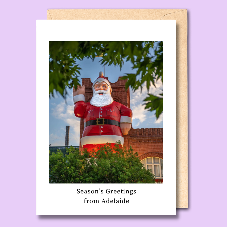 Greeting card with a photo of the giant santa on the facade of the Adelaide Central Markets on it. The text says “Season’s greetings from Adelaide.”