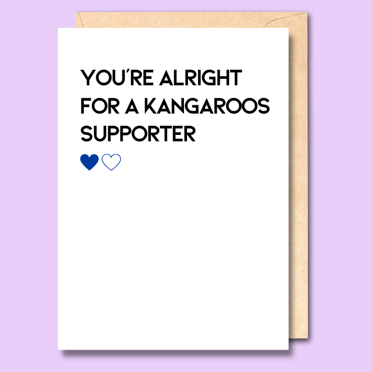 A white greeting card that says 'You're alright for a Kangaroos supporter'