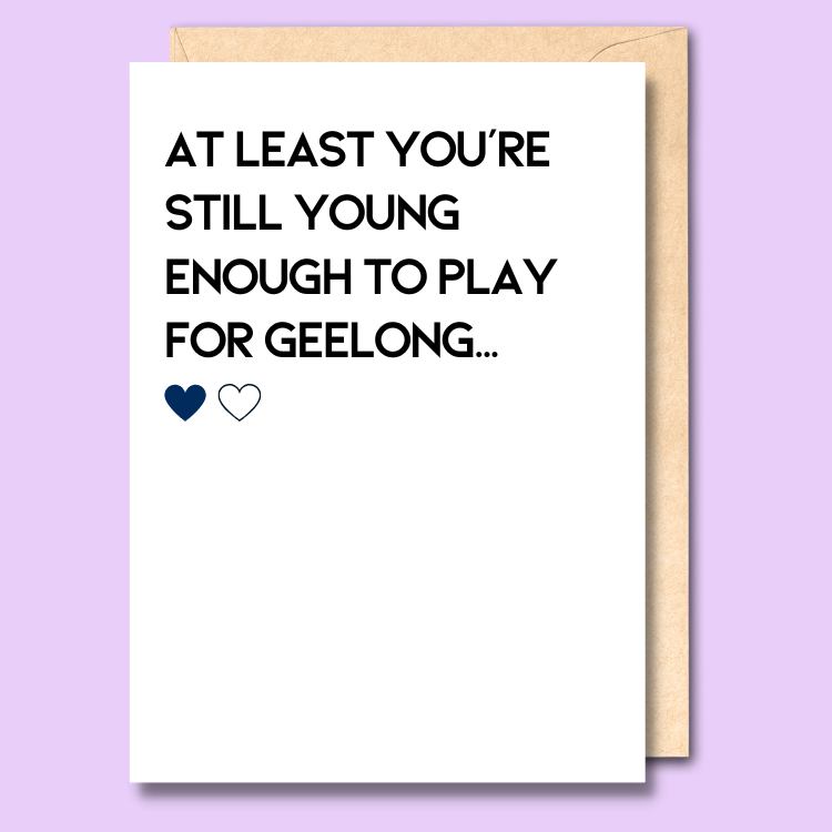 A white greeting card that says 'At least you're still young enough to play for Geelong'