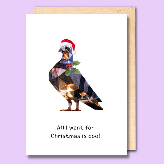 Greeting card with an image of the Rundle Mall pigeon on the front wearing a santa hat and some mistle toe. The text says “All I want for Christmas is coo.”