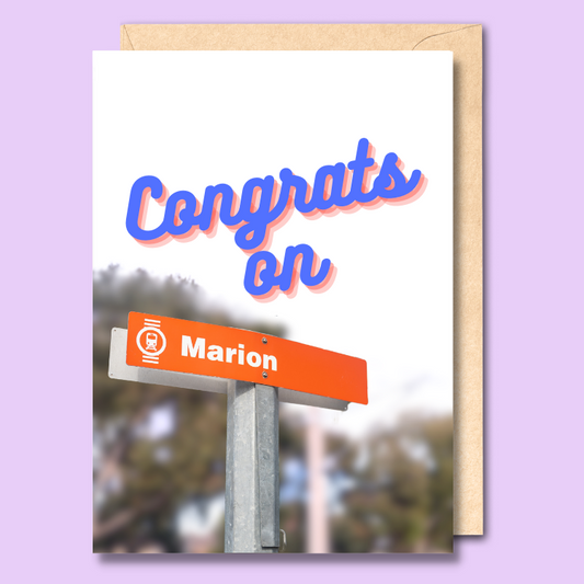 Greeting card with a with a photo of the Marion sign at Marion Railway Station. There is stylised text above the image saying 'Congrats on' to make the overall phrase of 'Congrats on Marion'.