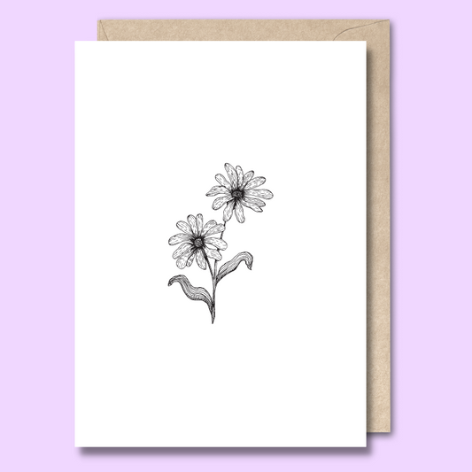 Front of a plain white greeting card with a black and white sketch of two daisies in the middle.