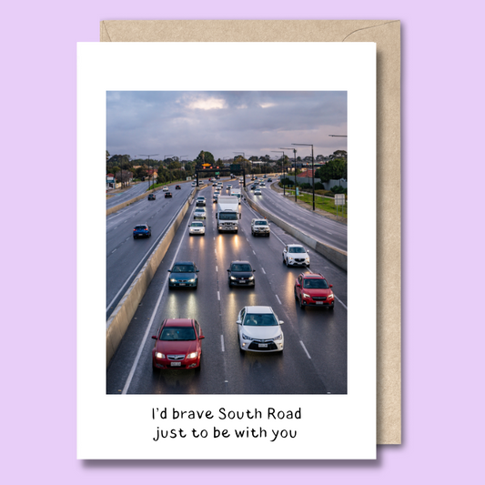 Greeting card with a photo of South Road in peak hour traffic on the front. The text says “I'd brave South Road just to be with you.”