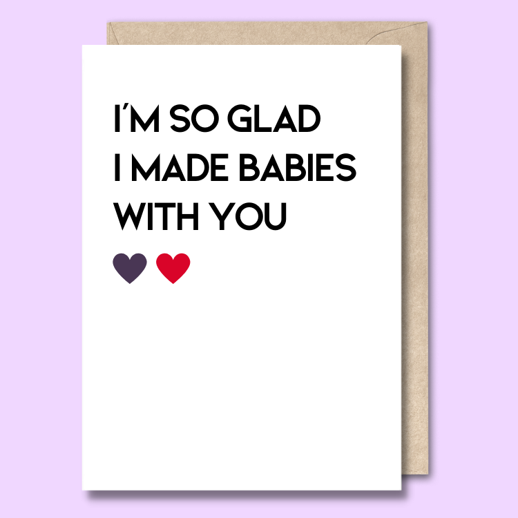 A plain white greeting card. On the front it says 'I'm so glad I made babies with you'.