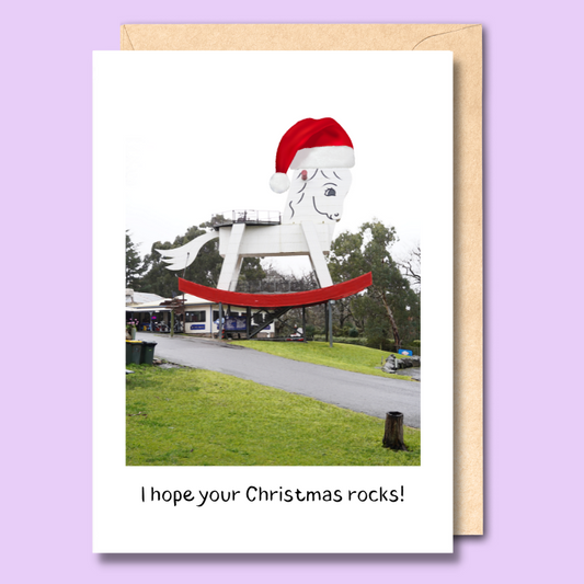 Greeting card with an image of the big rocking horse in Gumeracha wearing a santa hat. The text says “I hope your Christmas rocks.”