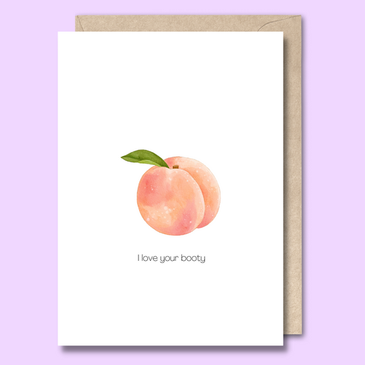 Front of a plain white greeting card with a pink and orange peach in the middle. The text says "I love your booty"