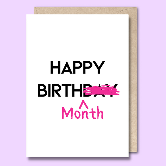 Greeting card with text on the front saying Happy Birthday Month. The word day is crossed out to emphasise that this is a person celebrating over a whole month. 