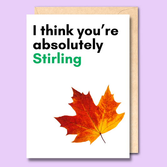 White greeting card with text saying "I think you're absolutely Stirling". There is a cut out photo of a red and orange maple leaf at the bottom of the card.