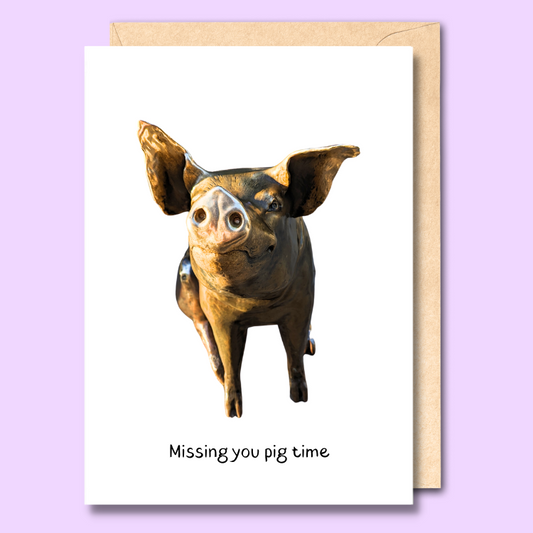 Greeting card with a cut out photo of one of the Rundle Mall pigs on the front. The text below the image says “Missing you pig time.”
