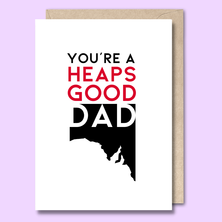 A plain white greeting card with 'You're a heaps good dad' written on the front. The dad is in white text overlayed on a black map of south australia