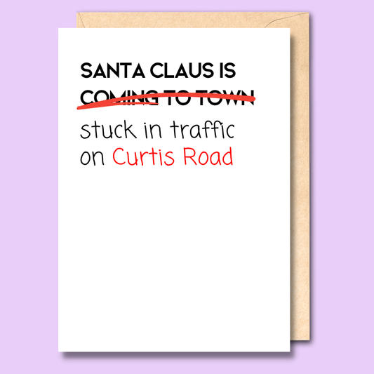 Card with text 'Santa Claus is stuck in traffic on Curtis Road' on a purple background