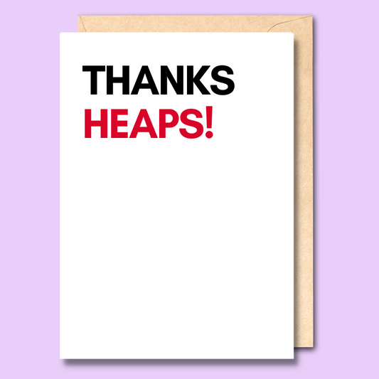 White greeting card with text saying "Thanks heaps". The word thanks is in bold black and the word heaps is in bold red.