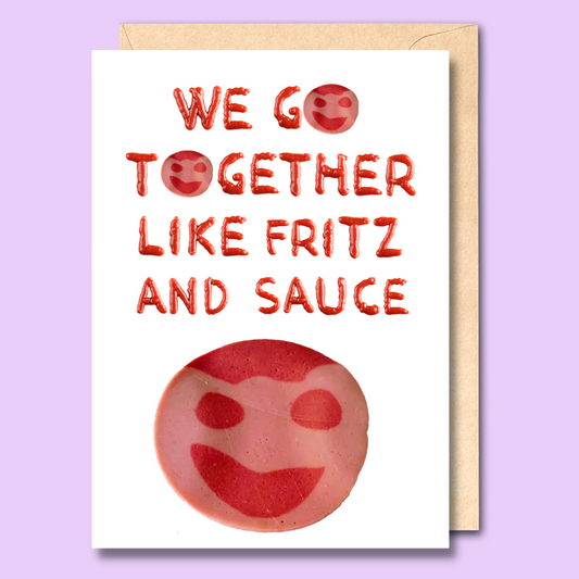 A white greeting card with 'We go together like fritz and sauce' written on it using tomato sauce. There is an image of a piece of tomato sauce at the bottom of the card.