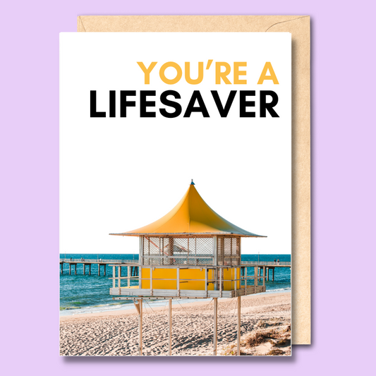 A white greeting card with a photo of the Brighton surf life saving tower on it. The text on the card says "you're a lifesaver".