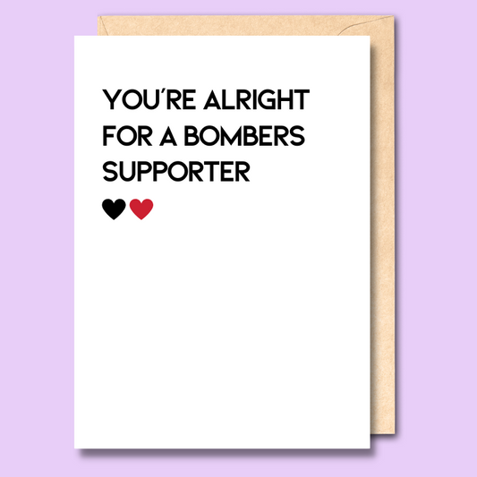 White greeting card that says 'You're alright for a bombers supporter' on the front.