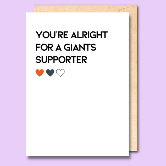 A white greeting card that says 'You're alright for a Giants supporter'