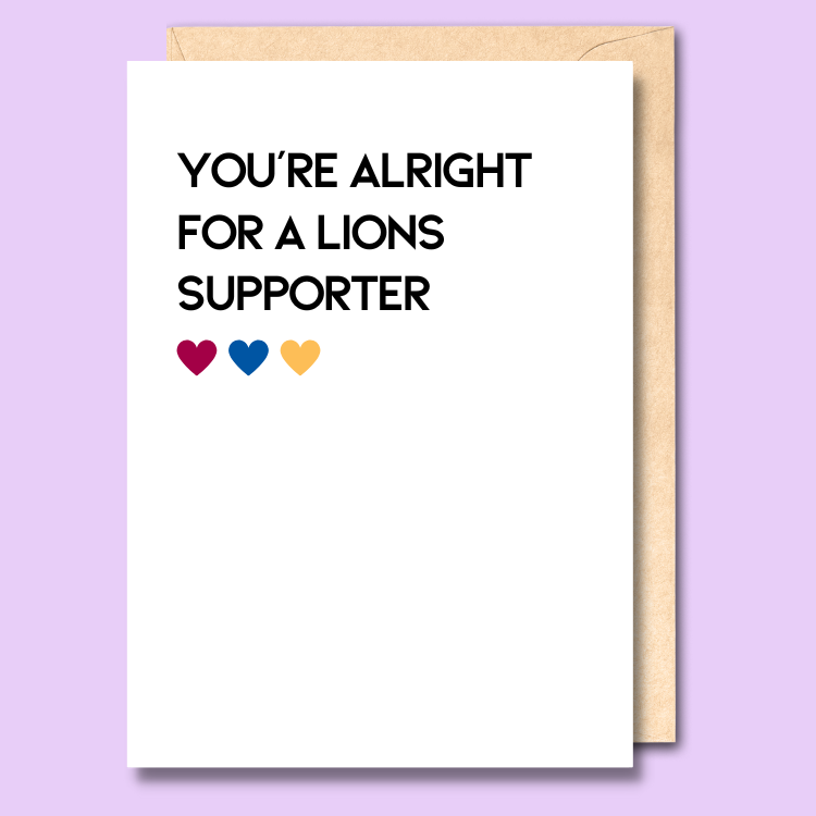 A white greeting card that says 'You're alright for a Lions supporter'