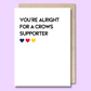Greeting card with text on the front that says “You’re alright for a Crows supporter.”