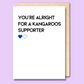 A white greeting card that says 'You're alright for a Kangaroos supporter'