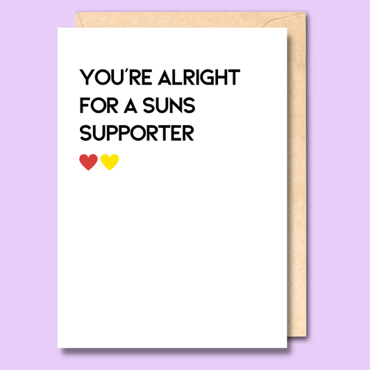 A white greeting card that says 'You're alright for a Suns supporter'