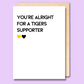 A white greeting card that says 'You're alright for a Tigers supporter'