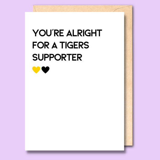 A white greeting card that says 'You're alright for a Tigers supporter'