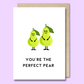 Greeting card with images of two green pears on the front. The text says “You’re the perfect pair”