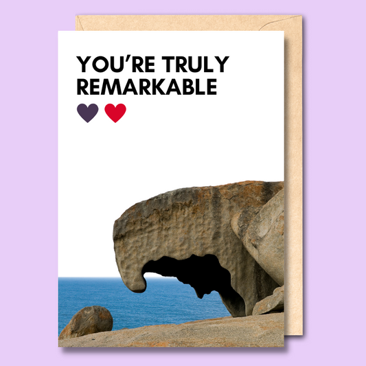 A greeting card with a white background. it has a cut out photo of Remarkable Rocks in South Australia at the bottom. The text on the front of the card says 'You're truly remarkable'
